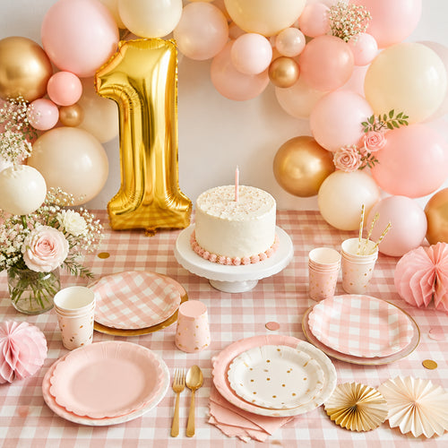 First birthday party kit styled table setup with gold number 1 balloon